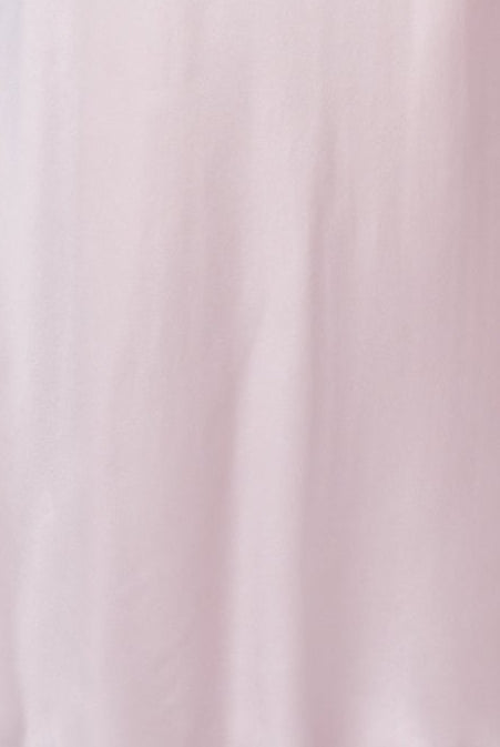 Pink satin nightgown on a mannequin against a white background