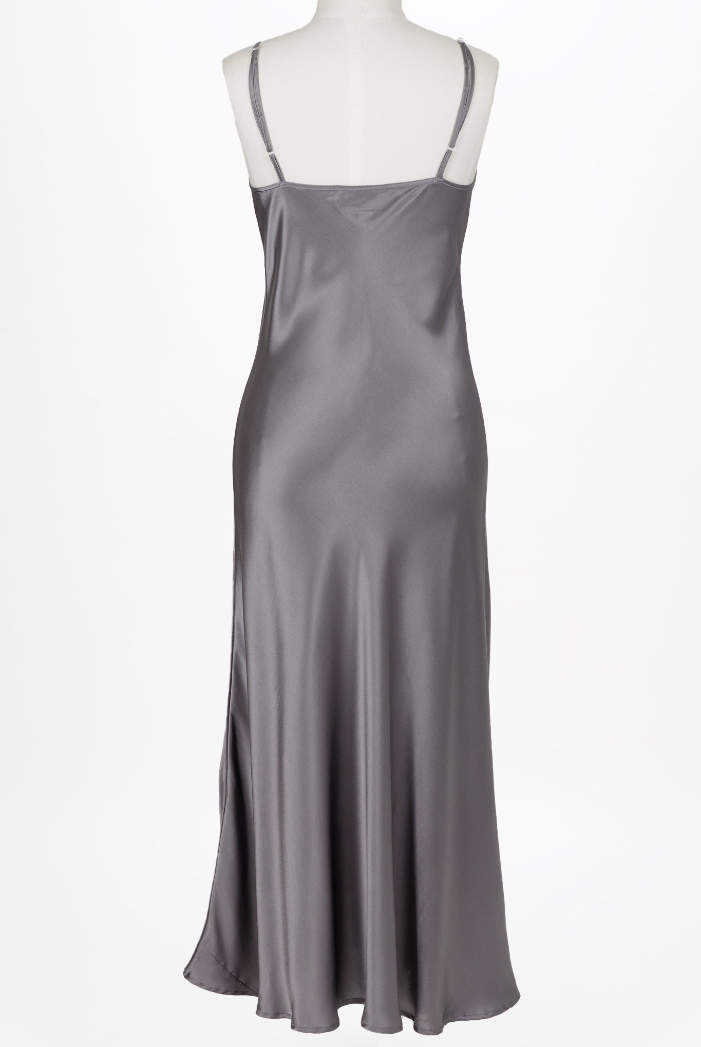 women wearing a dark grey long silk chemise dress with v neck and adjustable straps