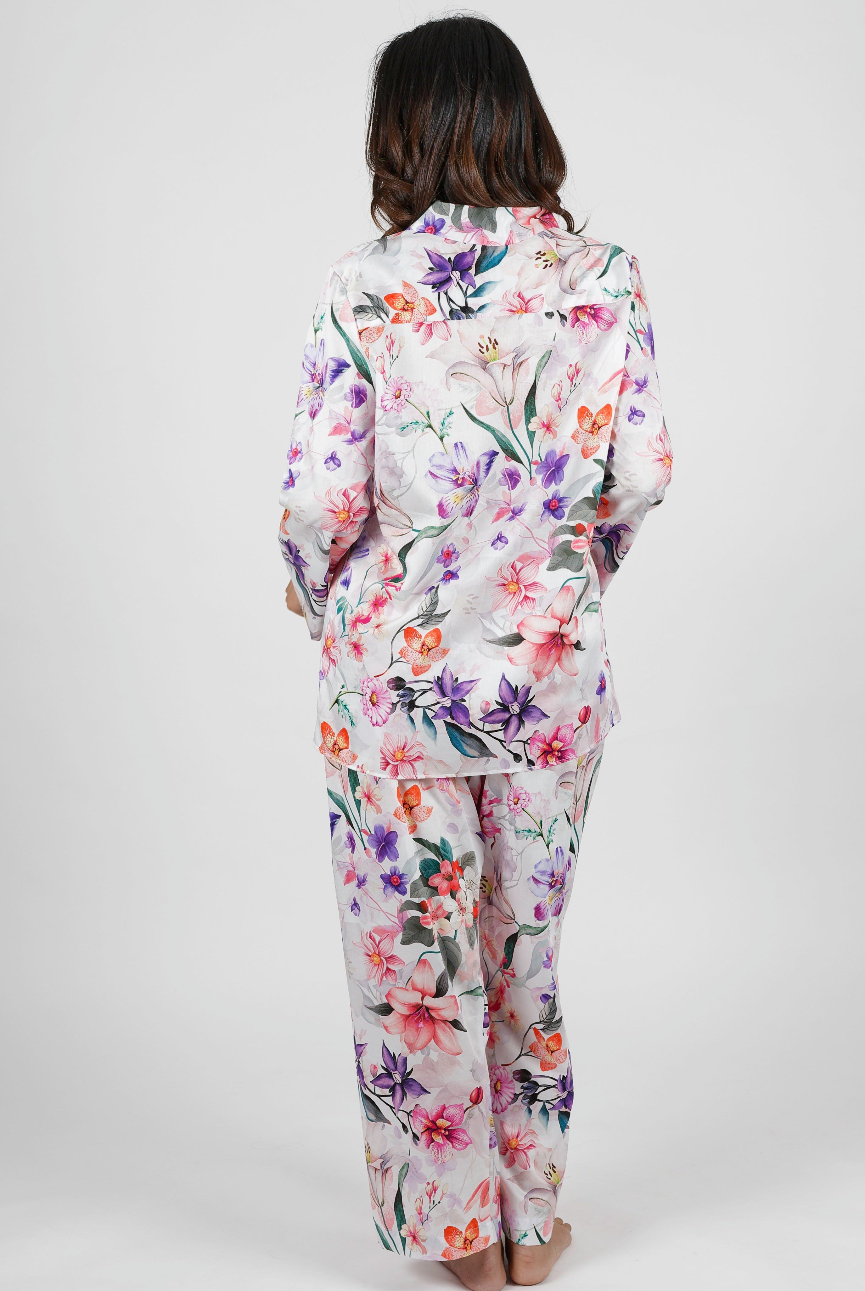 women wearing winter cotton floral pajamas with pink purple and orange flowers