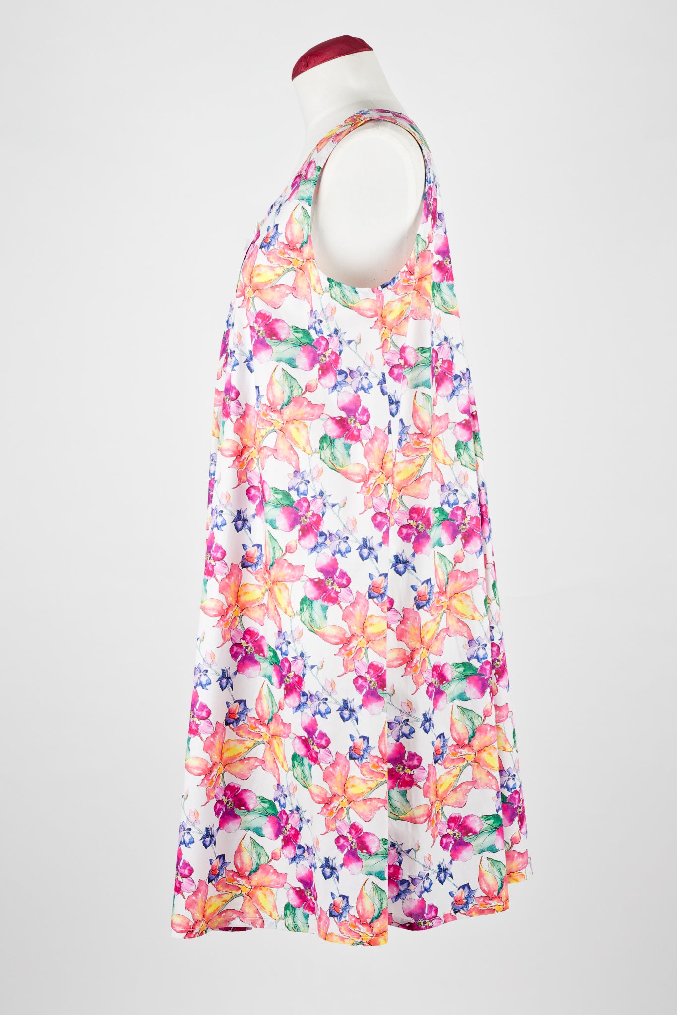 Colorful floral cotton nightie dress on a mannequin against a white background