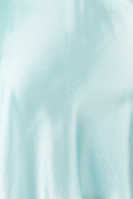 A light mint green satin silk slip dress displayed on a white mannequin torso against a light gray background.