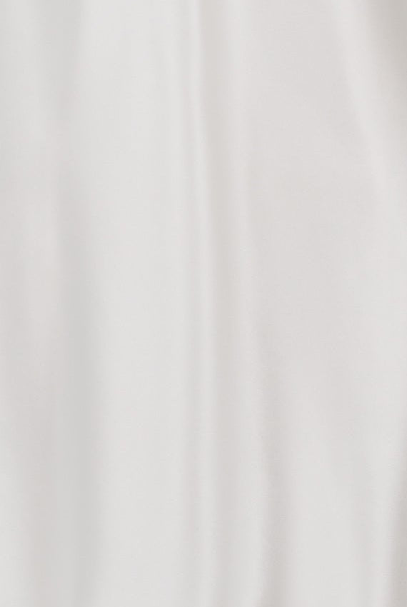 White sleeveless camisole on a mannequin against a white background