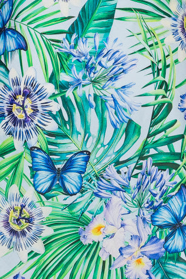 Green floral tropical nightie dress on a mannequin against a white background