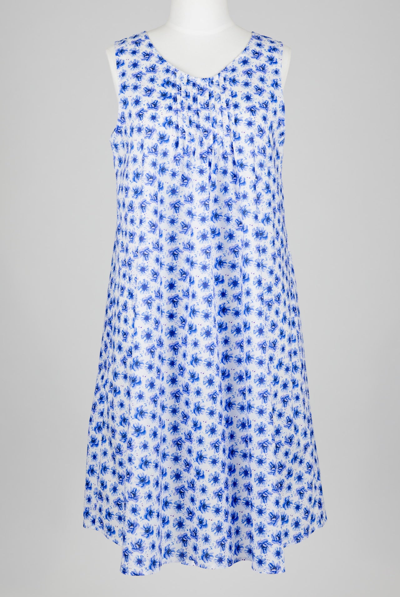 Blue floral cotton nightie dress on a mannequin against a gray background