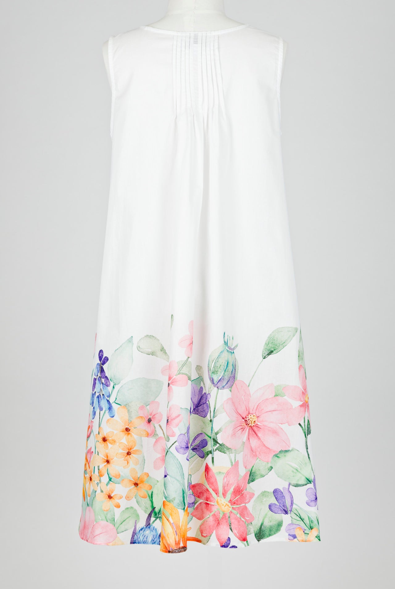 White sleeveless nightie dress with colorful floral patterns on a white background