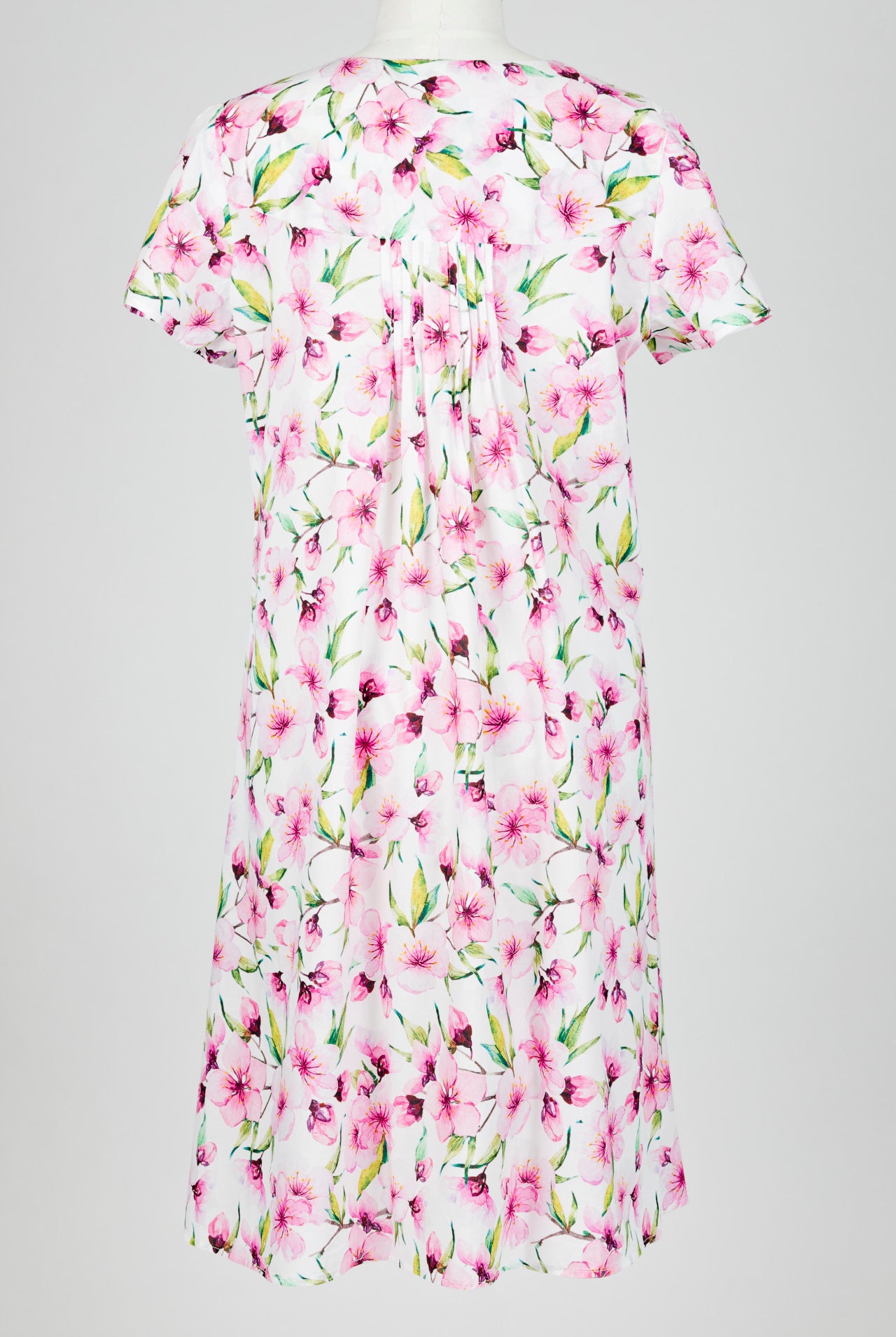 pink Floral patterned nightie dress on a mannequin against a white background