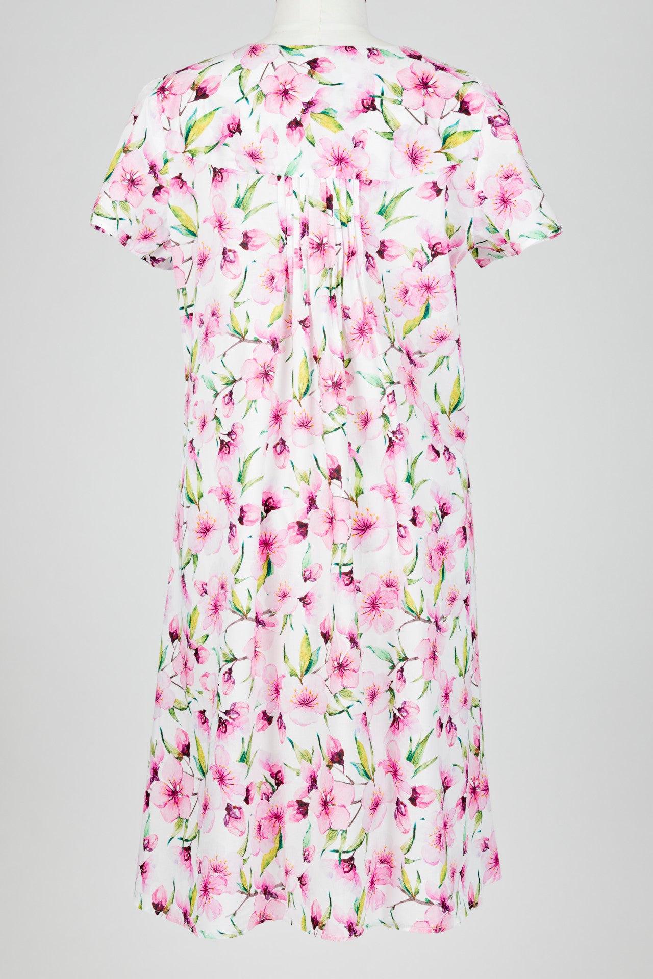 pink Floral patterned nightie dress on a mannequin against a white background