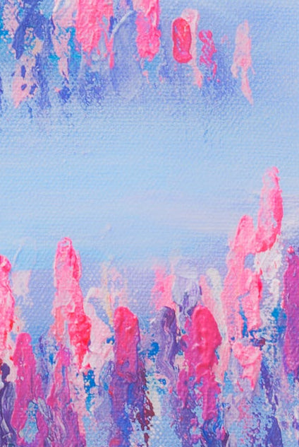 Abstract art with pink and blue brush strokes on a textured surface