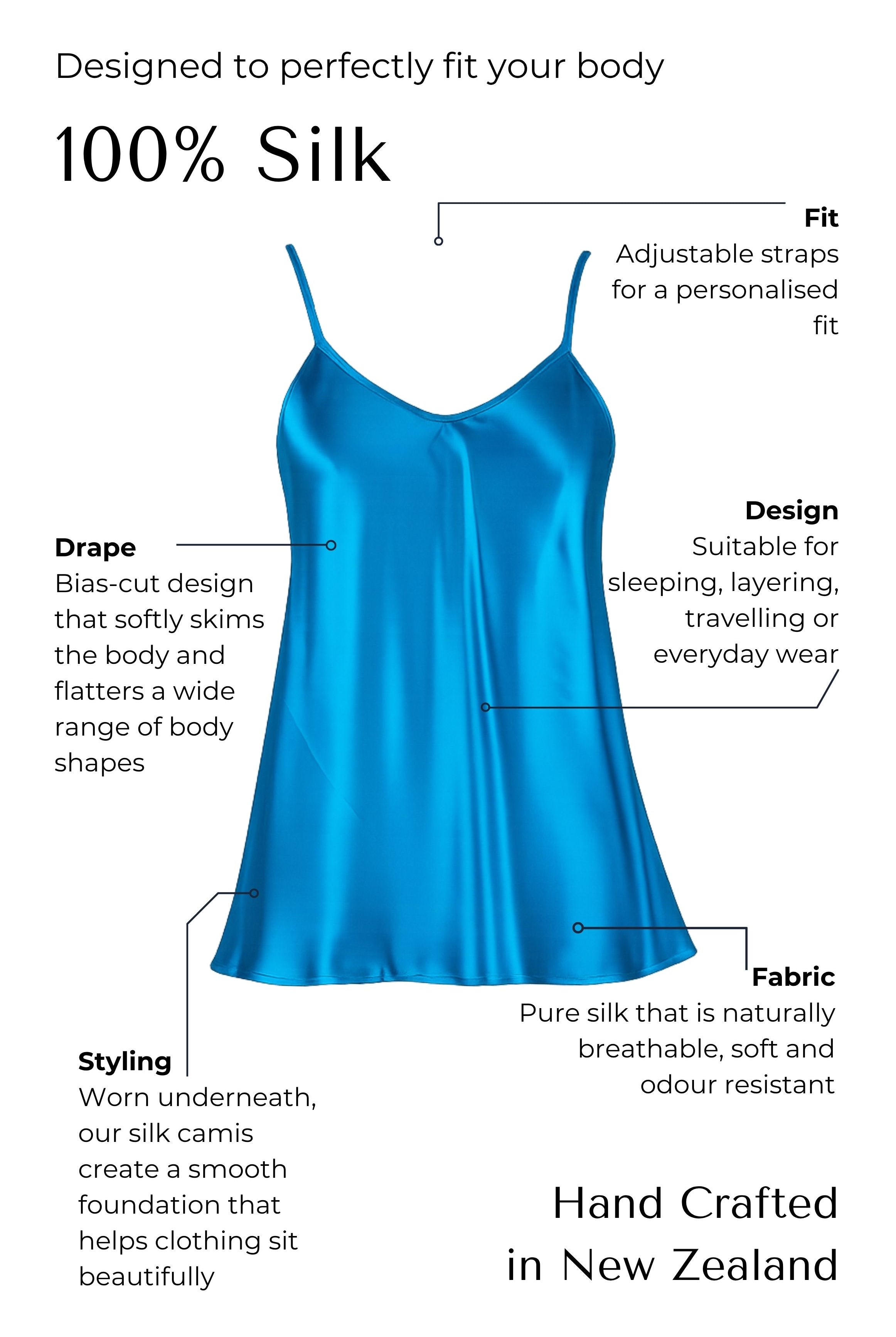 Blue silk camisole with features highlighted on a black background