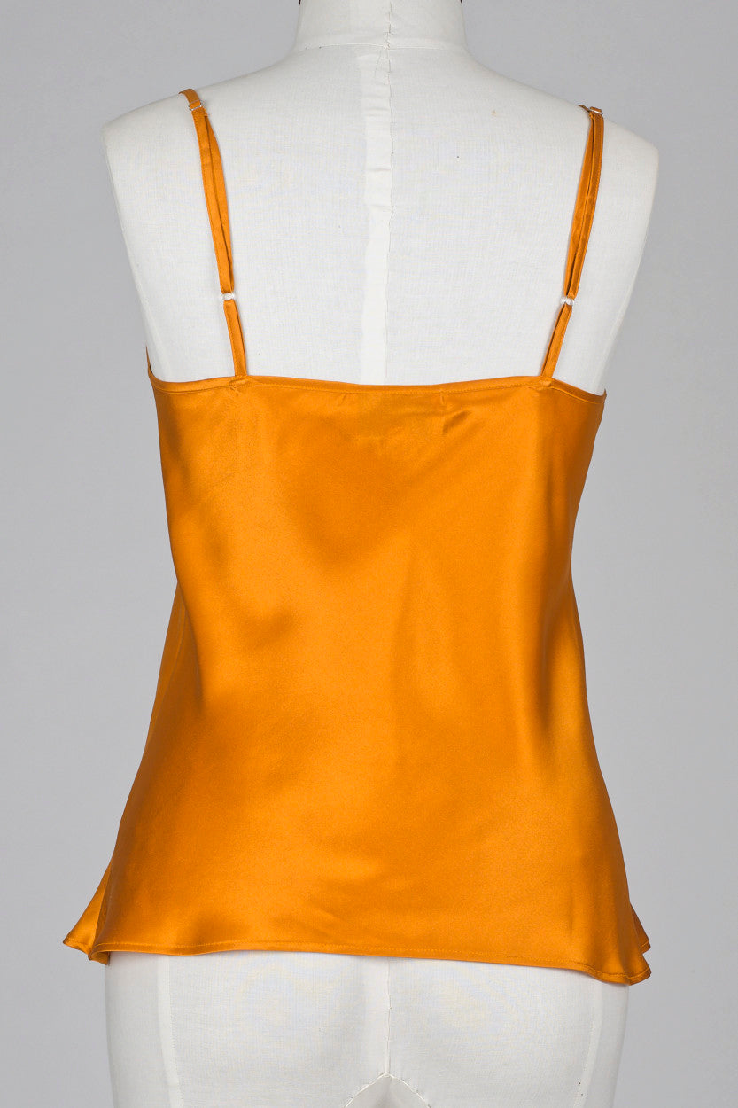Bronze silk satin camisole on a mannequin against a gray background