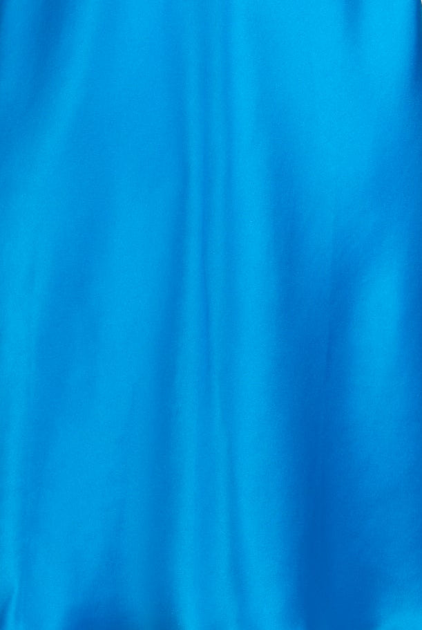 A bright blue satin slip dress with thin straps and a decorative embroidered neckline, displayed on a white mannequin torso against a light gray background.