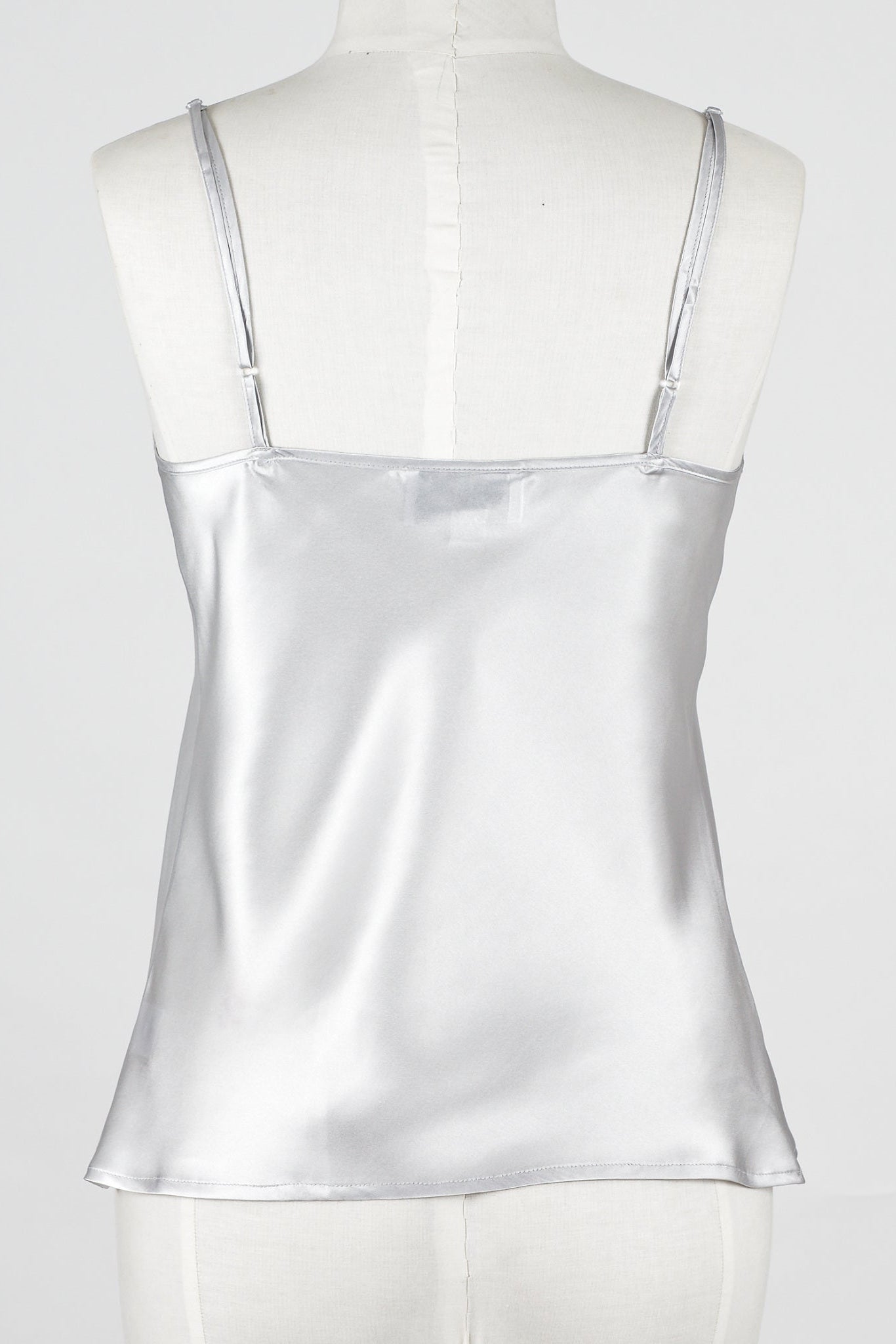  a silver gray silk camisole top with embroidered lace detailing.