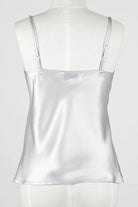  a silver gray silk camisole top with embroidered lace detailing.