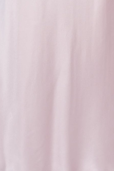 Pink satin nightgown on a mannequin against a white background