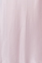Pink satin nightgown on a mannequin against a white background