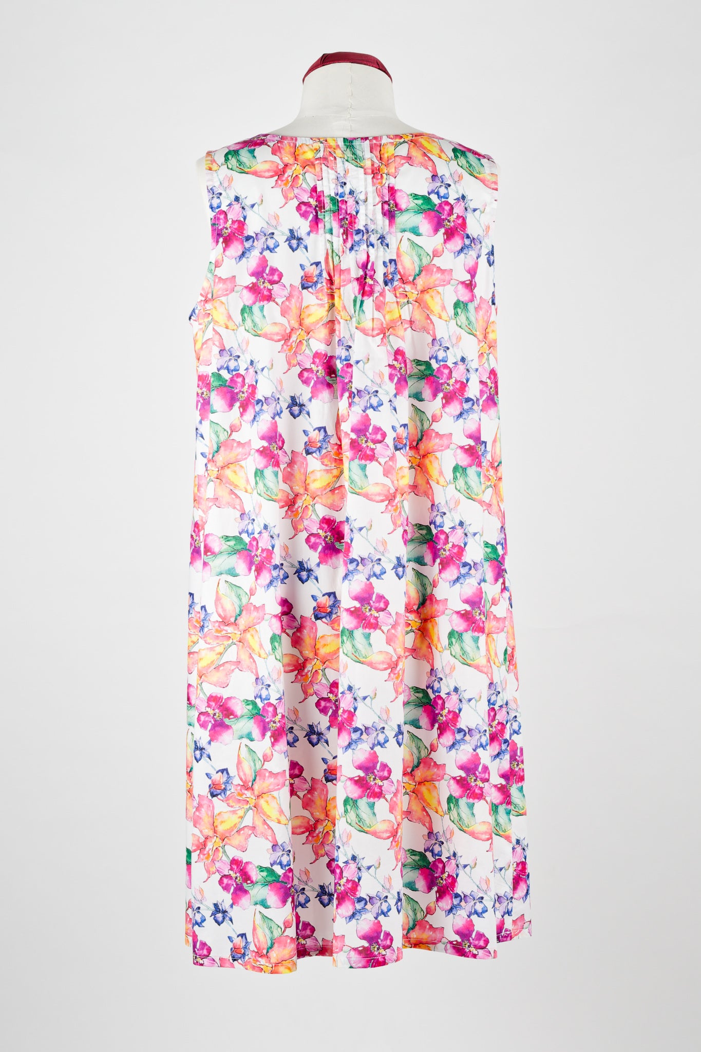 Colorful floral cotton nightie dress on a mannequin against a white background