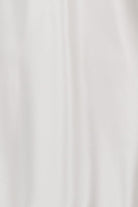 White sleeveless camisole on a mannequin against a white background