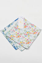 Set of floral-patterned fabric womens hankies on a light gray background