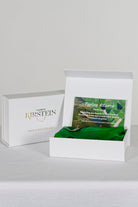 green silk satin scarf with farmland print in a white box  