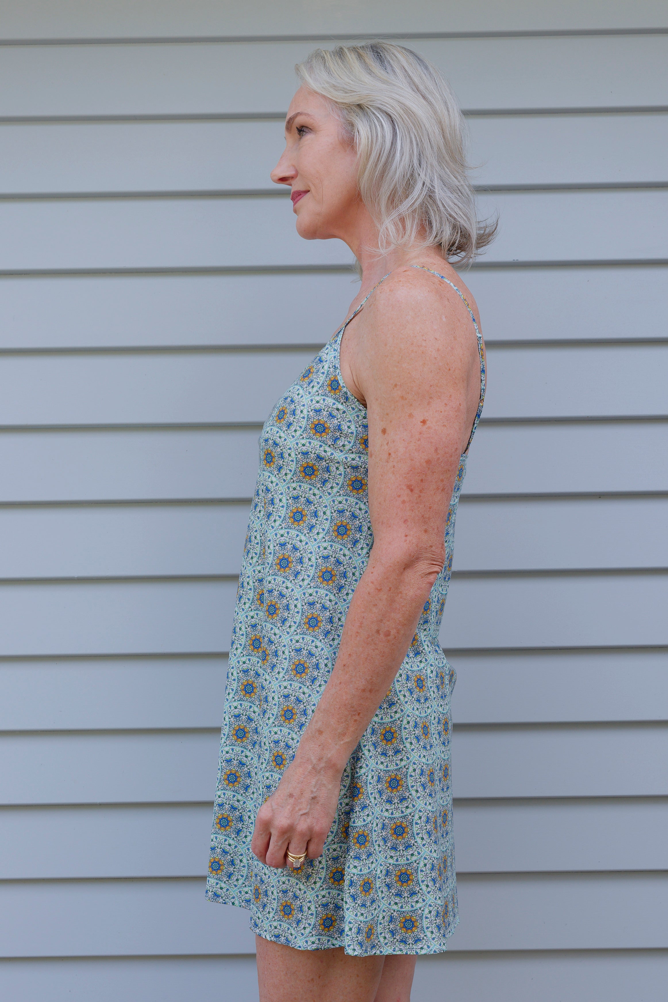 woman wearing cotton nightie dress with green and blue print