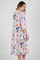 woman wearing cotton floral print nightie with purple pink and orange flowers