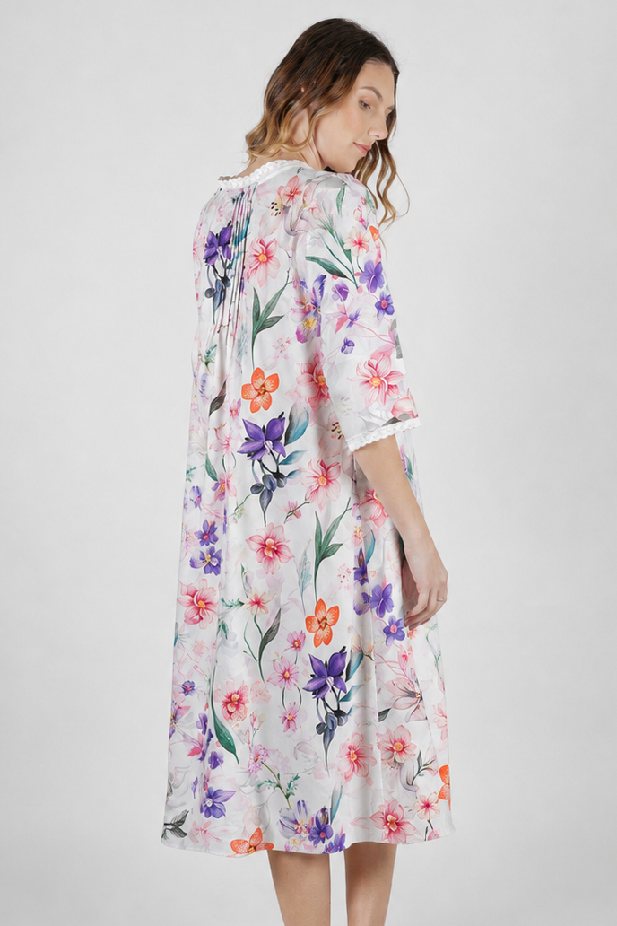 woman wearing cotton floral print nightie with purple pink and orange flowers