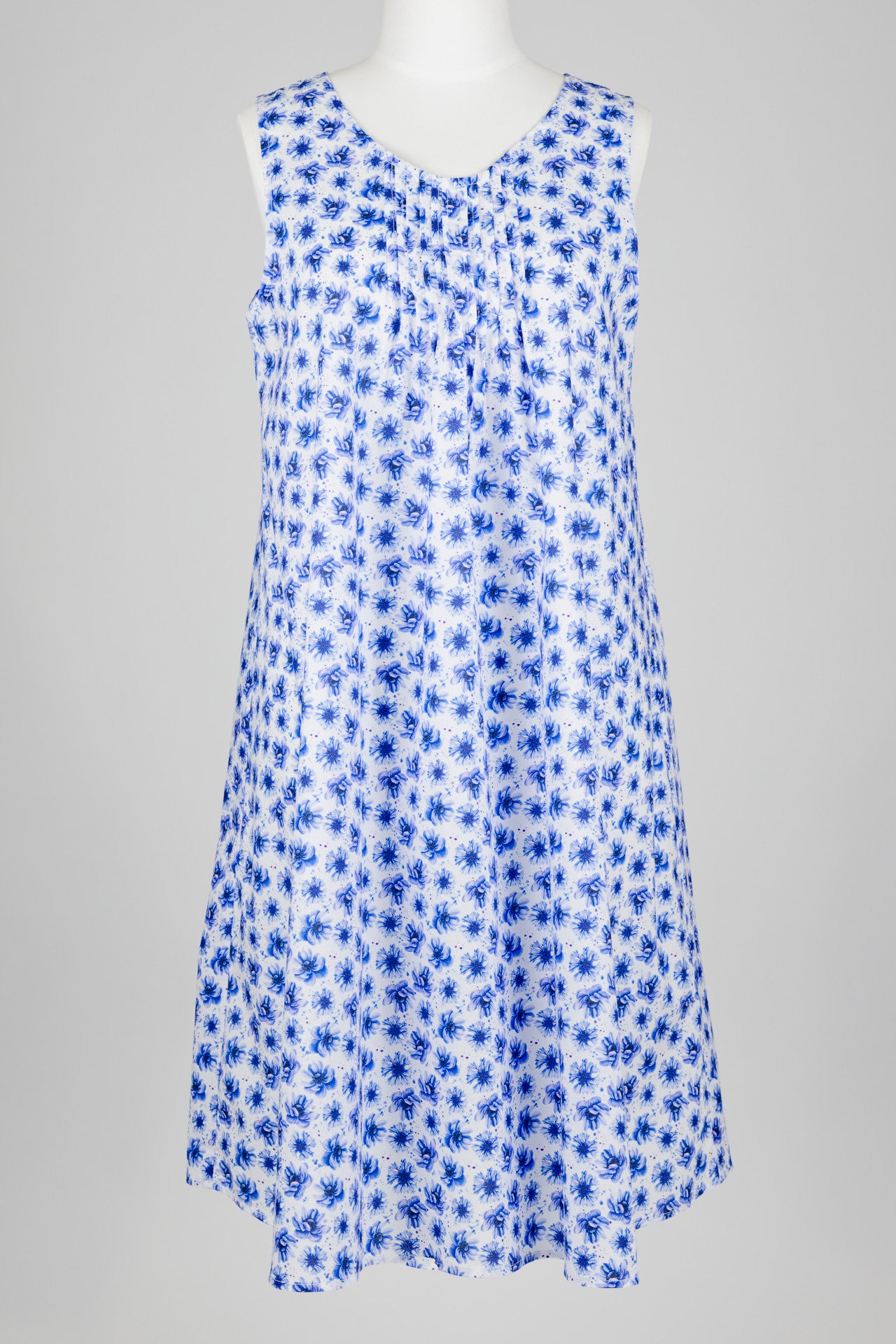 Blue floral cotton nightie dress on a mannequin against a gray background