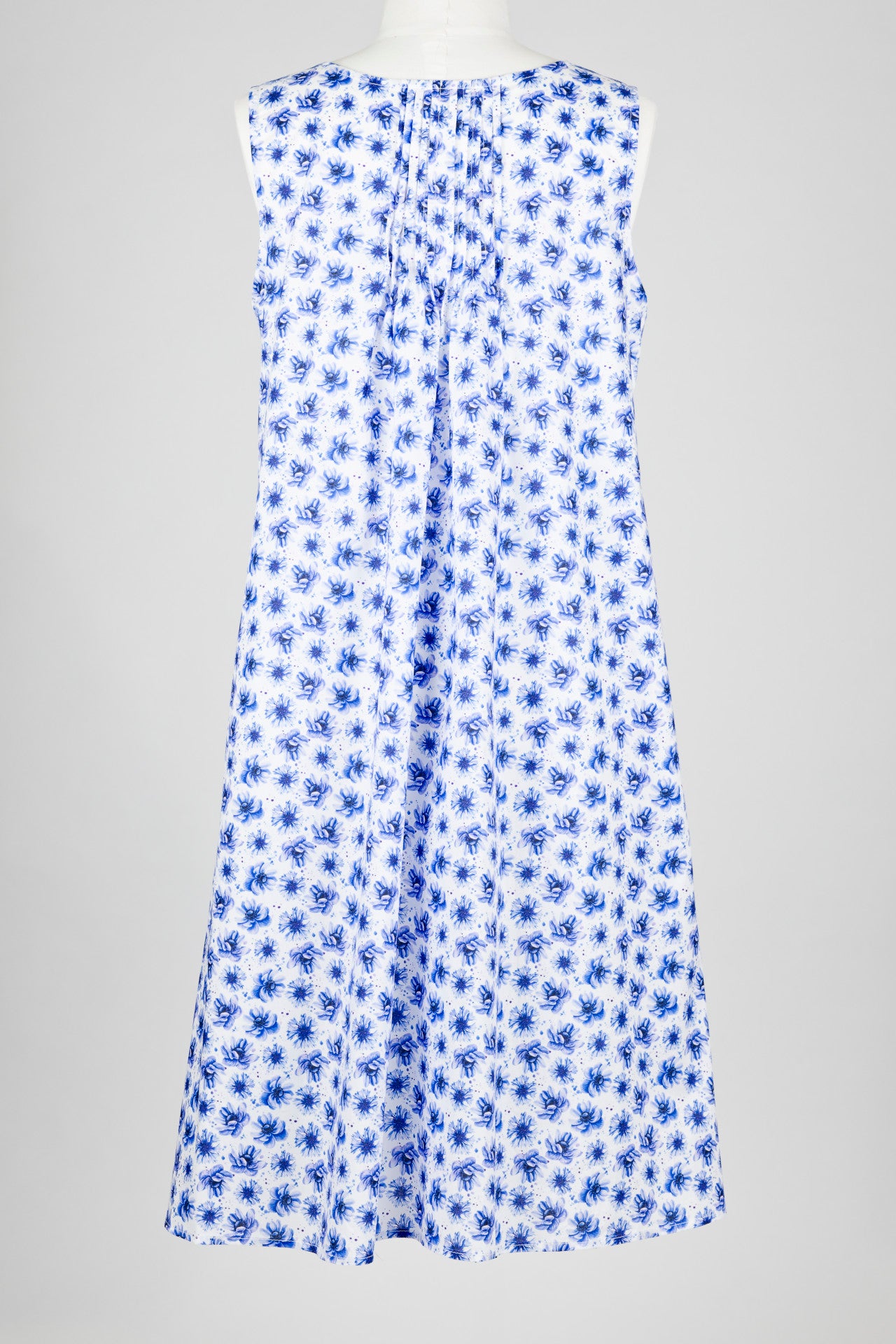 Blue floral cotton nightie dress on a mannequin against a gray background