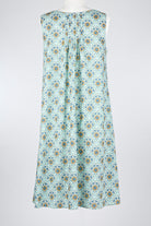 geometric green patterned cotton nightie dress on a mannequin against a white background 