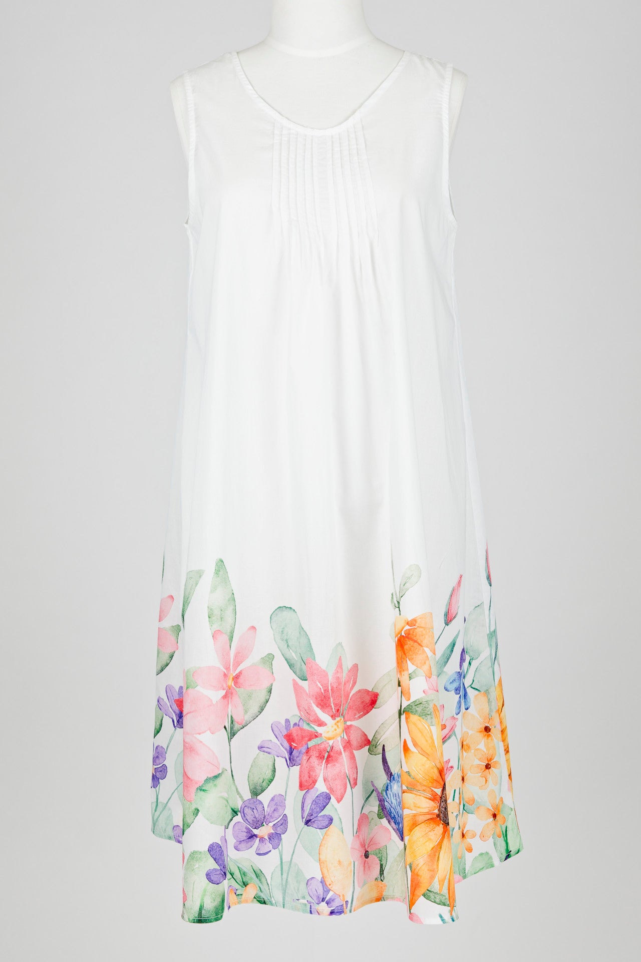 White sleeveless nightie dress with colorful floral patterns on a white background