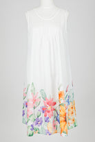 White sleeveless nightie dress with colorful floral patterns on a white background
