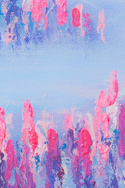 Abstract art with pink and blue brush strokes on a textured surface