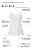 Silk  white camisole with features highlighted on a black background