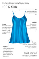 Blue silk camisole with features highlighted on a black background