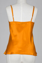 Bronze silk satin camisole on a mannequin against a gray background