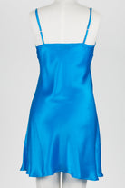 A bright blue satin slip dress with thin shoulder straps, displayed on a white mannequin torso against a light gray studio background.