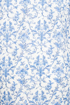detail of white cotton fabric with blue floral pattern