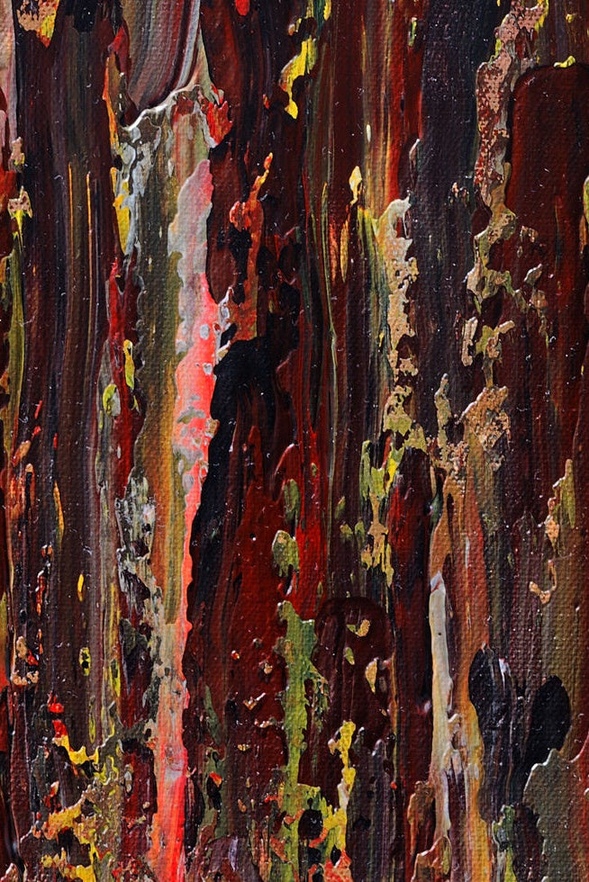 Abstract art with vibrant red and earthy colors and textures