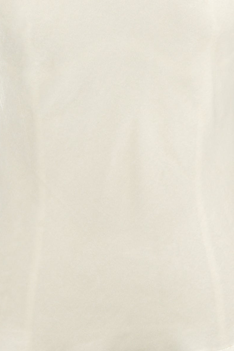  ivory silk velvet cami with a V-neck and adjustable spaghetti straps